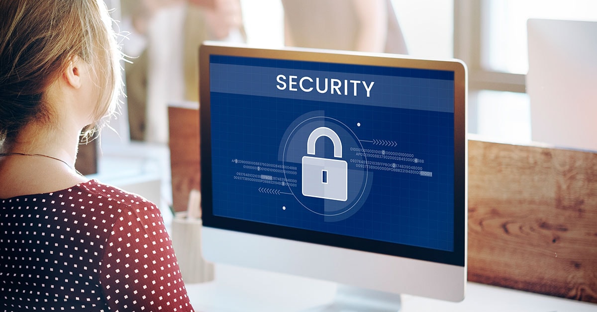 Privileged Identity Management displayed on a computer screen with a security lock icon, emphasizing secure access control and digital protection measures